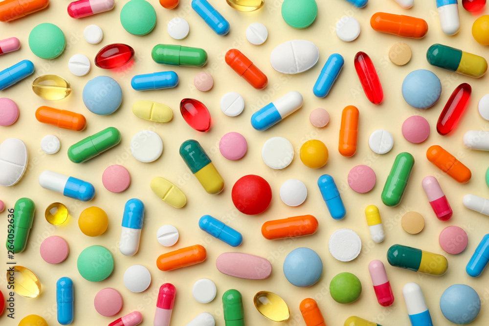 Many different pills on color background, flat lay Many different pills on color background, flat lay