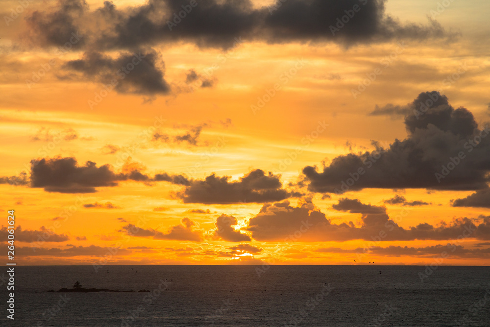 Spectacular golden sunrise over ocean