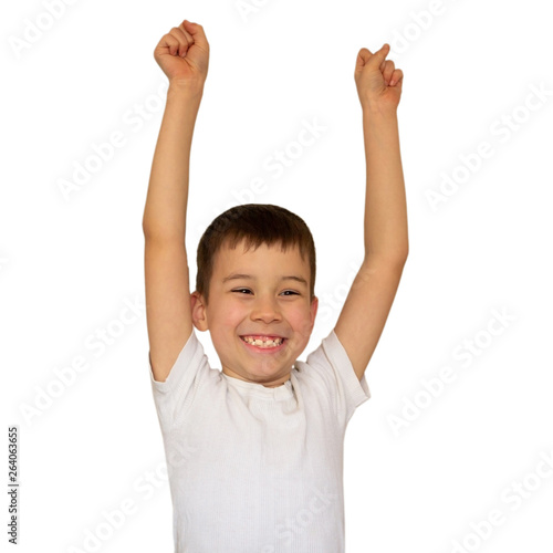 A boy in a light T-shirt celebrating a happy, smiling laugh with raising hands on a white background, copy space, close-up, isolate