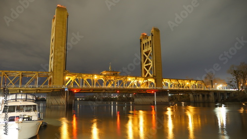 Sacramento tower bridge and river at night