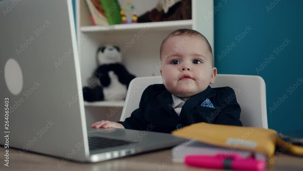 Look around little boy businessman boss in office use laptop write notebook sitting play creative little happy job work child computer education young suit cute career confident close up slow motion Look around little boy businessman boss in office use laptop write notebook sitting play creative little happy job work child computer education young suit cute career confident close up slow motion