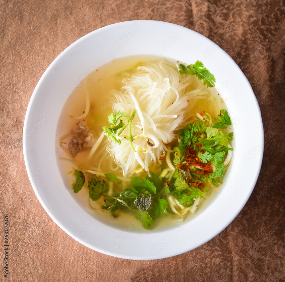 Noodle soup bowl Thai Laos Vietnam and Chinese with pork meat and vegetables asian style food Noodle soup bowl Thai Laos Vietnam and Chinese with pork meat and vegetables asian style food