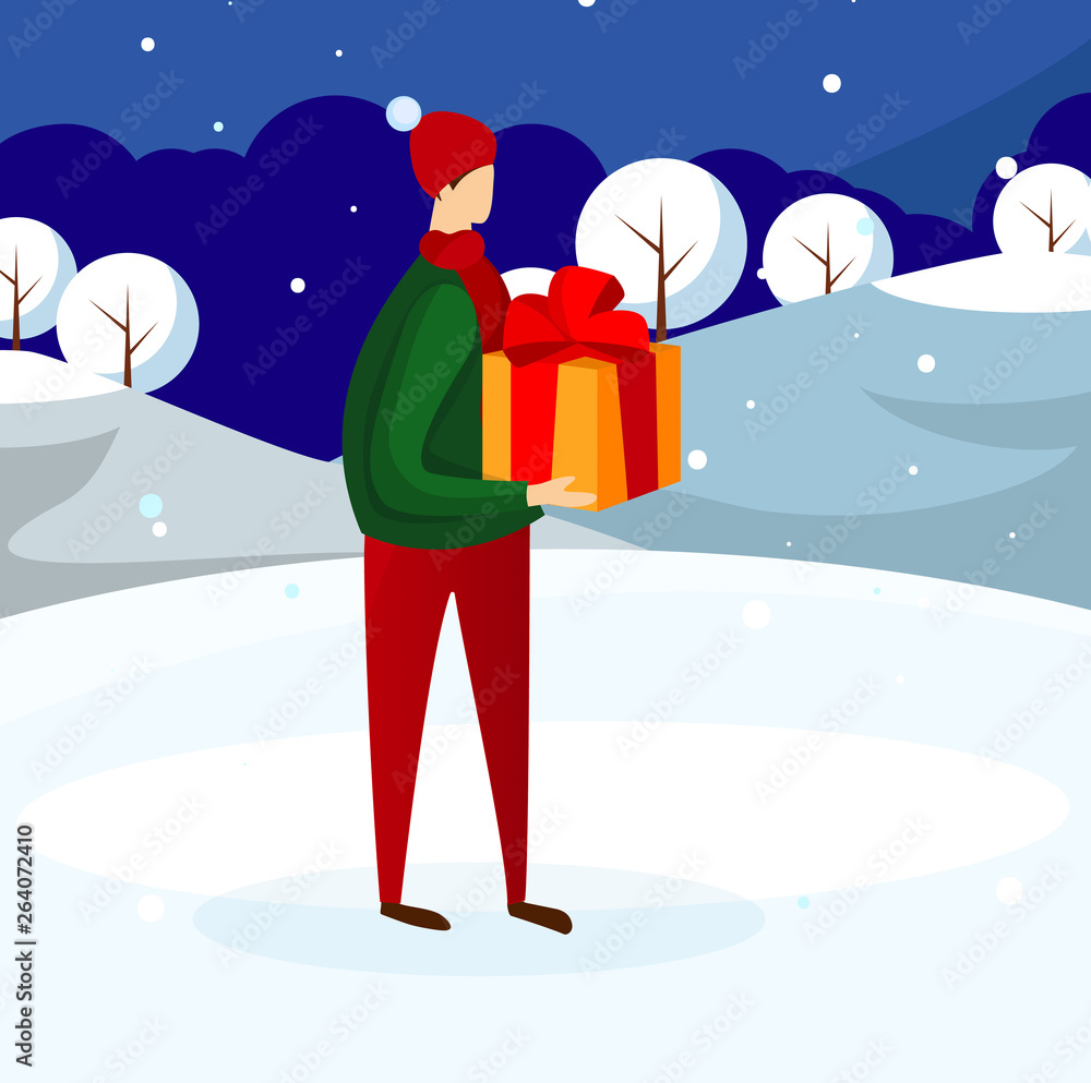 Young Guy in Winter Clothing Holding Present Box. Young Guy in Winter Clothing Holding Present Box.