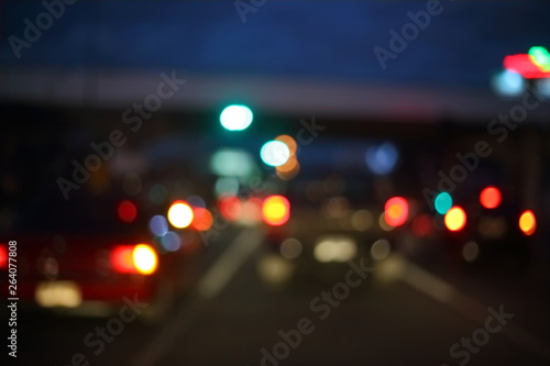 traffic light of driving car on city night street road, abstract blur bokeh background © sutichak