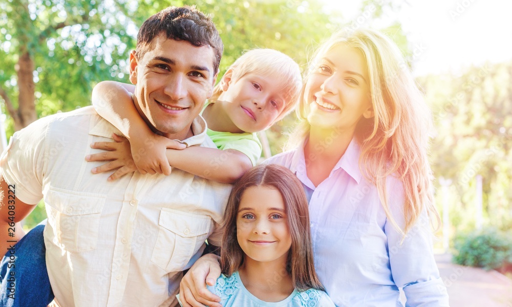 Beautiful smiling Lovely family in park