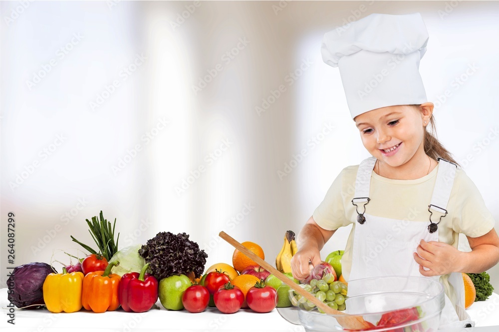 Portrait of adorable little girl preparing healthy food at kitchen Portrait of adorable little girl preparing healthy food at kitchen
