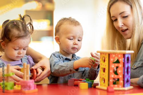 Kids play with shapes and c...
