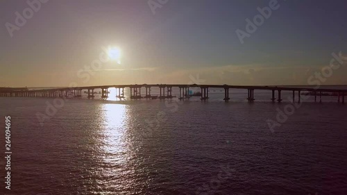 Wallpaper Mural A beautiful bridge crosses a bay in Florida at sunset with cars passing over it. Torontodigital.ca