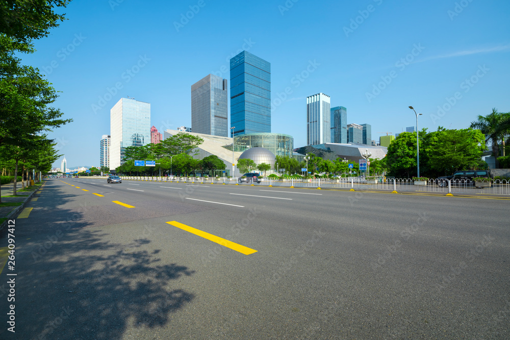 Shenzhen highway transportation and the high-rise building under the blue sky.