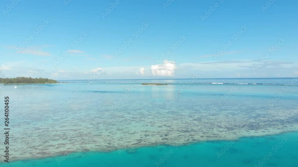 Aerial Forward: Marble Blue Ocean Out To Horizon With Blue Sky Above in Moorea, French Polynesia Aerial Forward: Marble Blue Ocean Out To Horizon With Blue Sky Above in Moorea, French Polynesia