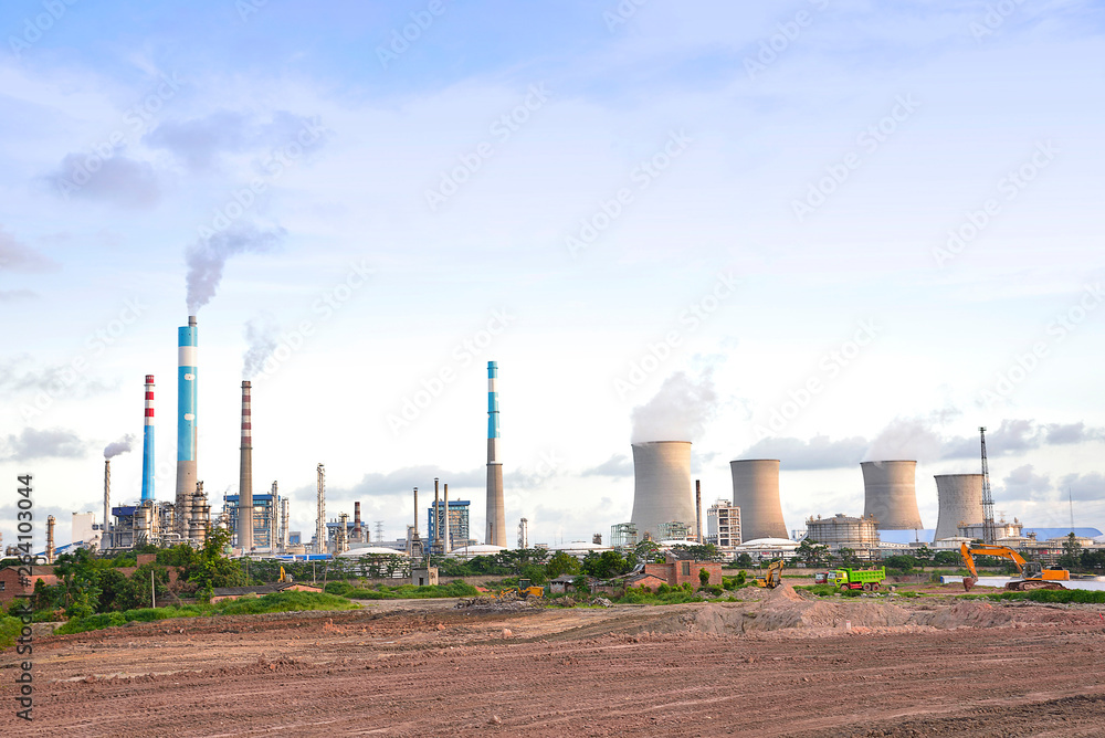Oil refineries and power plants under the blue sky white clouds Oil refineries and power plants under the blue sky white clouds