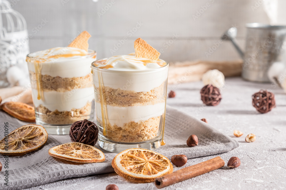 Layered mascarpone dessert with crushed vanilla biscuits and carame Layered mascarpone dessert with crushed vanilla biscuits and carame