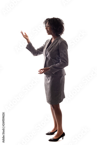 Side View of a Black Businesswoman gesturing like she is speaking or giving a speech like a teacher, presenter or a political candidate campaigning.