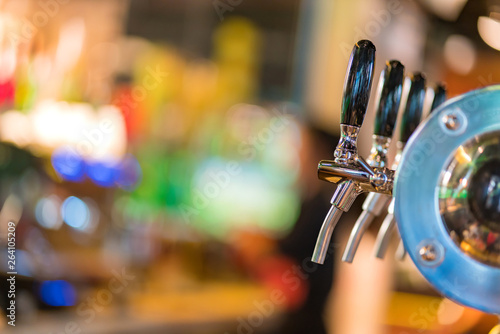 beer taps in pub or nightclub.