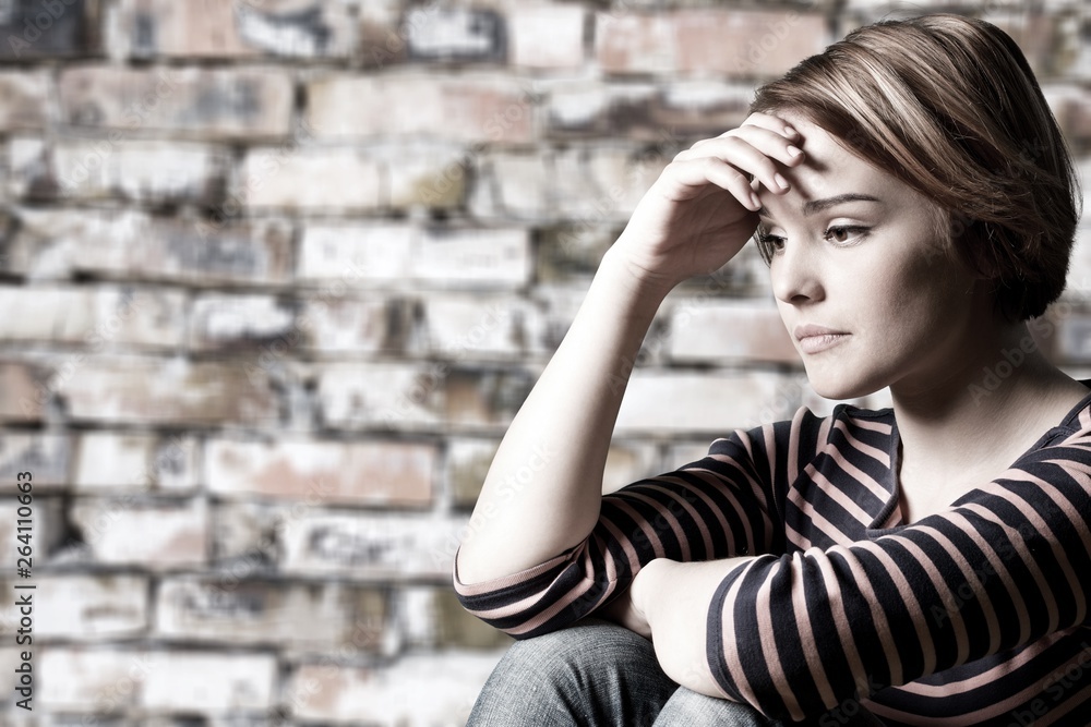 Young woman crying on background Young woman crying on background