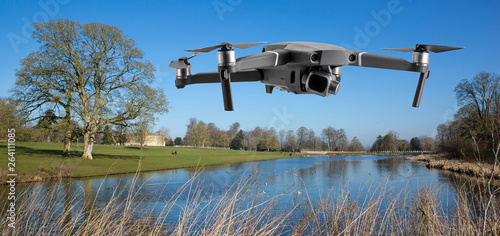 Drone flys by the lake at Lydiard House, Lydiard Park  Swindon, Wiltshire, UK photo