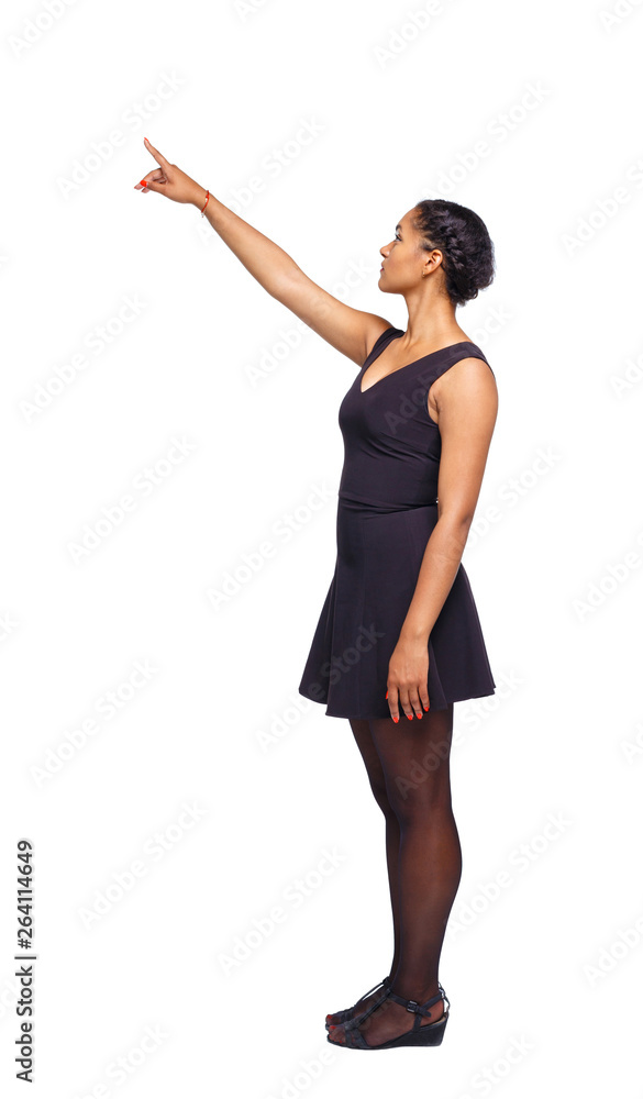 Side view of a black African-American woman in a brown dress poi Side view of a black African-American woman in a brown dress poi