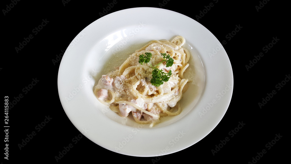 close-up spaghetti carbonara bacon with clipping part isolated on black background close-up spaghetti carbonara bacon with clipping part isolated on black background