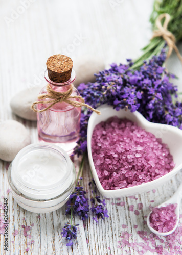 Heart-shaped bowl with sea salt  oil  and fresh lavender flowers