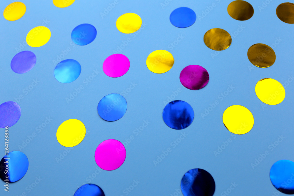 Round confetti on blue background. Festive design. There is a place for text. Round confetti on blue background. Festive design. There is a place for text.