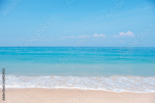 Landscape of tropical beach in summer. Sandy beach with sea waves and blue sky background. Holiday  vacation - Image