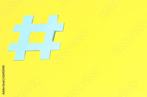 Hashtag sign isolated on background, close-up, copy space