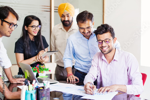 Indian business team discussing a project photo