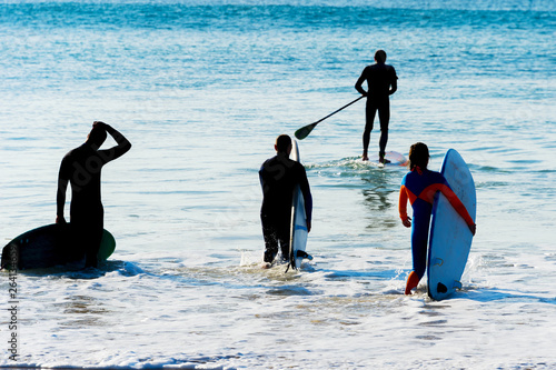 Group surfers going  surf S...