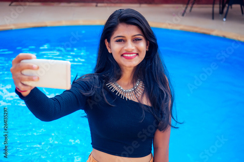 Canvas Print beautiful indian woman toothy white smile selfie portrait on smartphone camera s
