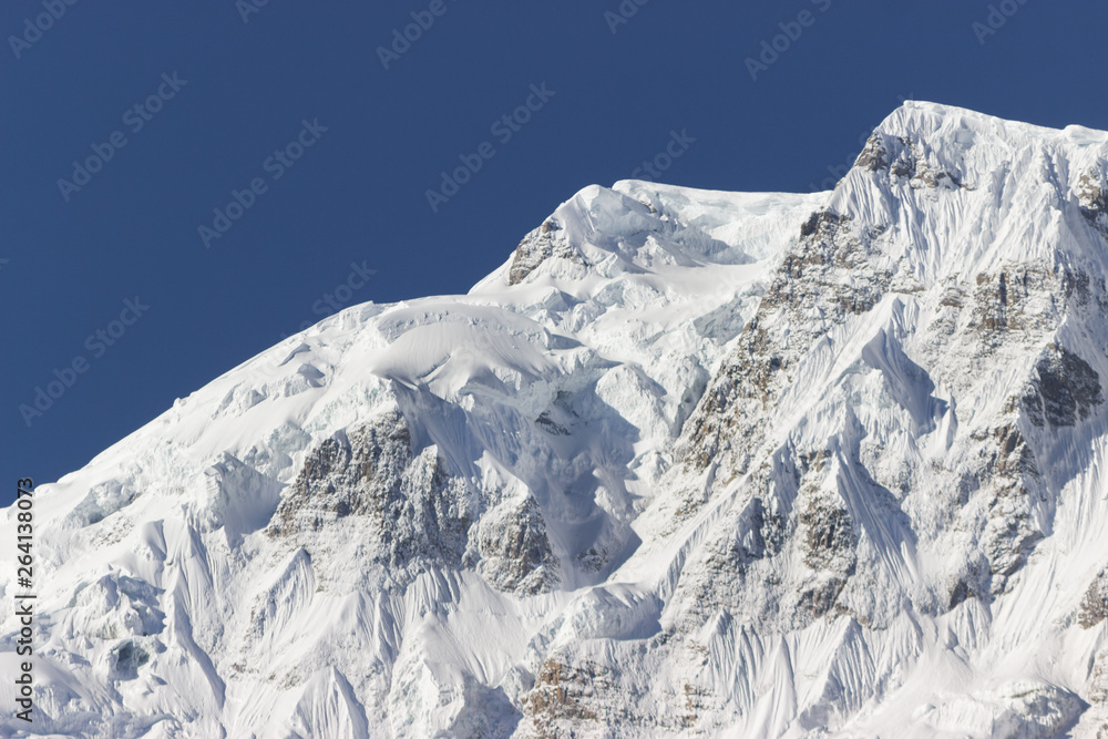 giant ice peak high in the mountains,  scenery of Nepal, Annapurna hiking