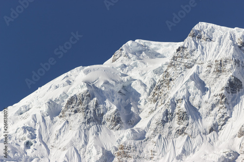 giant ice peak high in the mountains,  scenery of Nepal, Annapurna hiking © Павел Чепелев