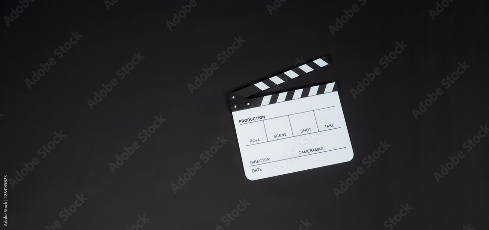 White Clapperboard or clap board or movie slate on black background. It's use in video production , film, cinema industry.