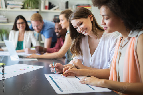 Group of successful business people at work in office