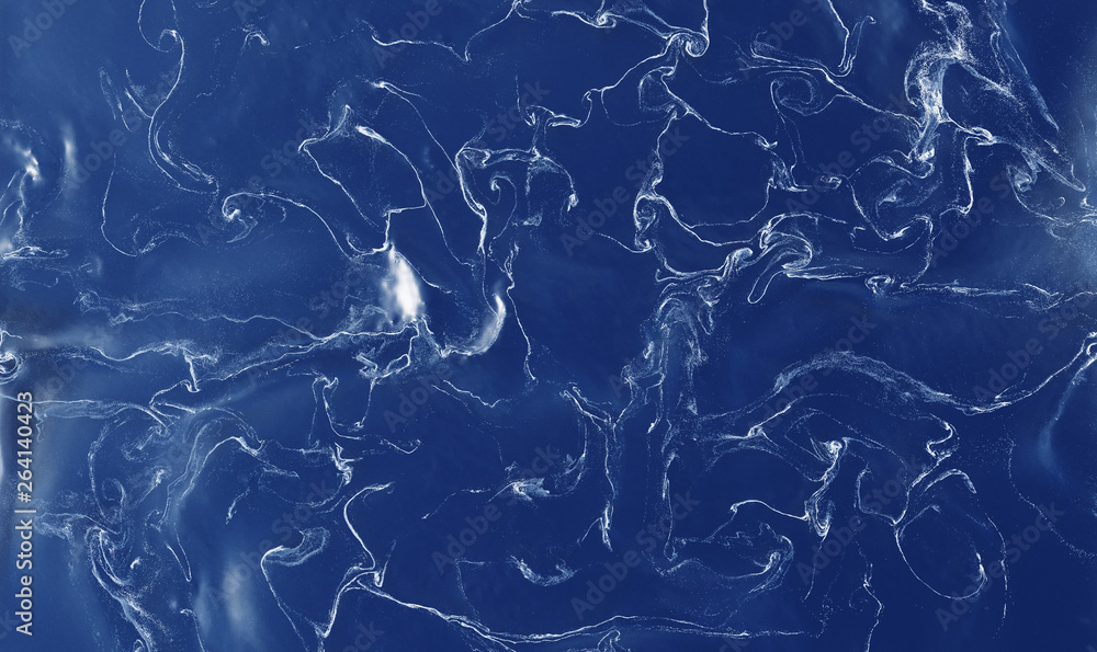 Many White thin Swirls and Waves in a blue Liquid