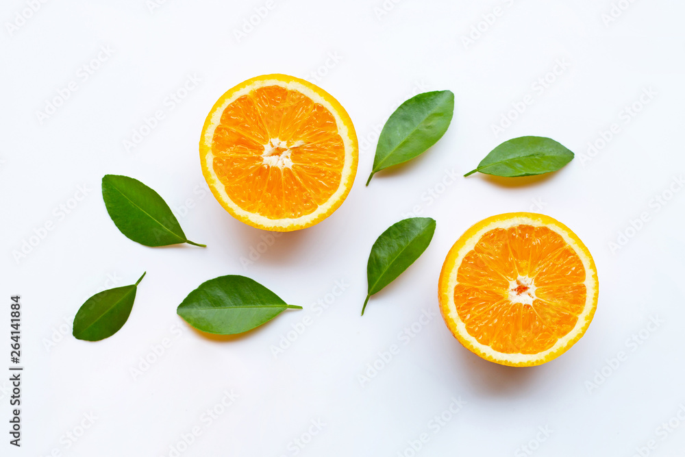 Fresh orange citrus fruits with leaves on white Fresh orange citrus fruits with leaves on white