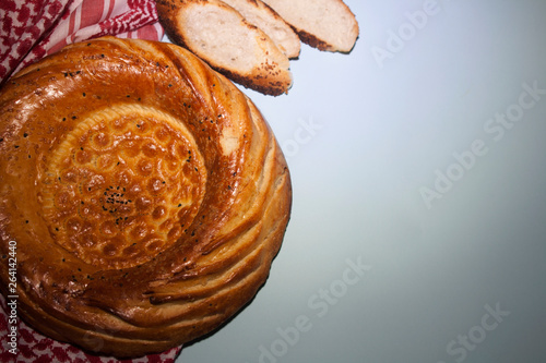 Asian bread / National uzbek round  tandyr bread photo