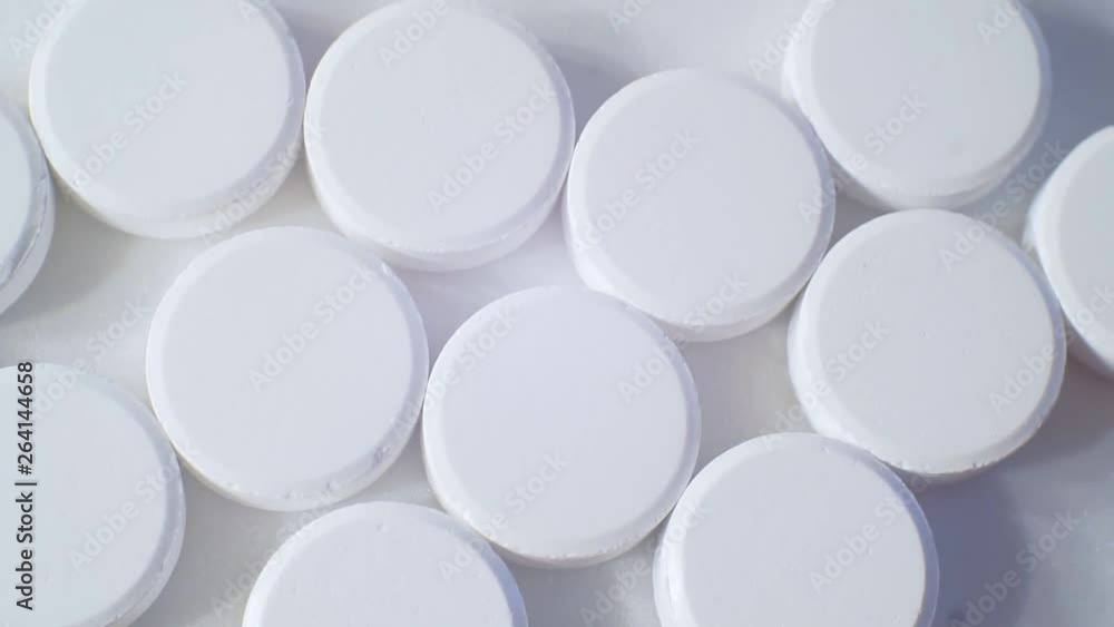 large round tablets on a light surface large round tablets on a light surface