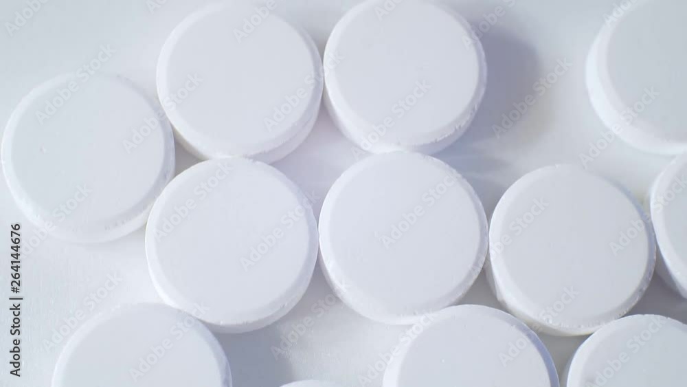 large round tablets on a light surface. large round tablets on a light surface.