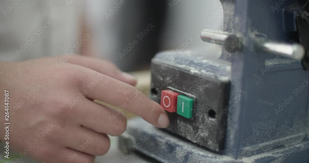 Industrial Start Stop Button. Finger Pushing Button In Factory Industrial Start Stop Button. Finger Pushing Button In Factory