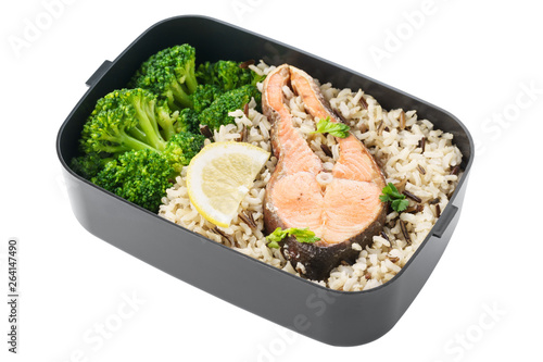 Healthy lunch box with brown rice, broccoli and salmon.