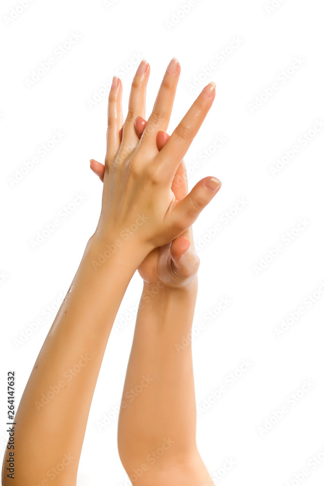 closeup of female hands applying hand cream on white background closeup of female hands applying hand cream on white background