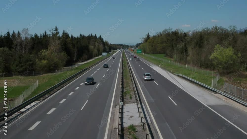 Highway traffic in Europe. Road overpass. Vehicles driving up and down. Not busy. No traffic jam. Highway traffic in Europe. Road overpass. Vehicles driving up and down. Not busy. No traffic jam.