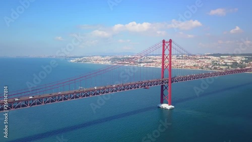 Wallpaper Mural Aerial, tracking, drone shot, overlooking traffic, on the Salazar bridge, and road A2, cars and trucks, heading towards Lisboa city, on a sunny day, on Tagus river, in Lisbon, Portugal Torontodigital.ca