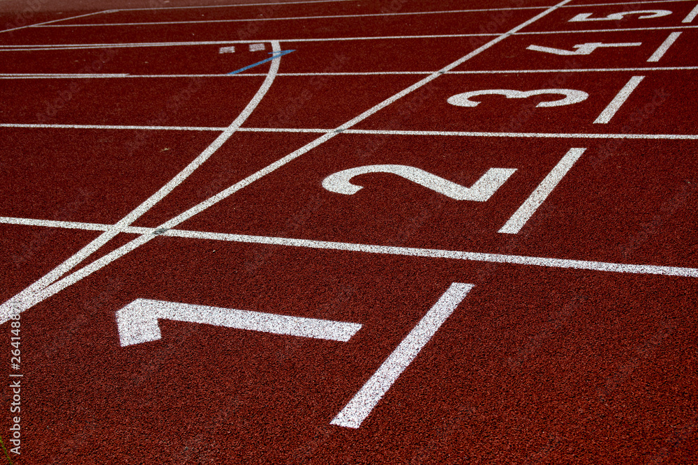 Running track with numbers, one to five, red surface with white lines