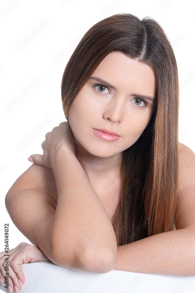 Portrait of beautiful young woman posing on white background