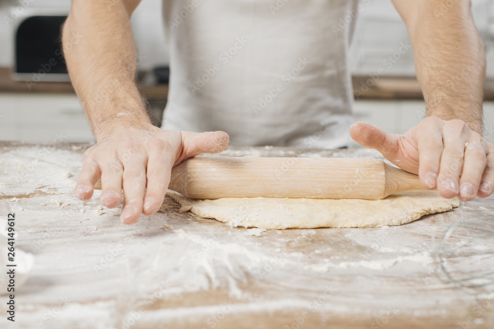 Man making pizza dough