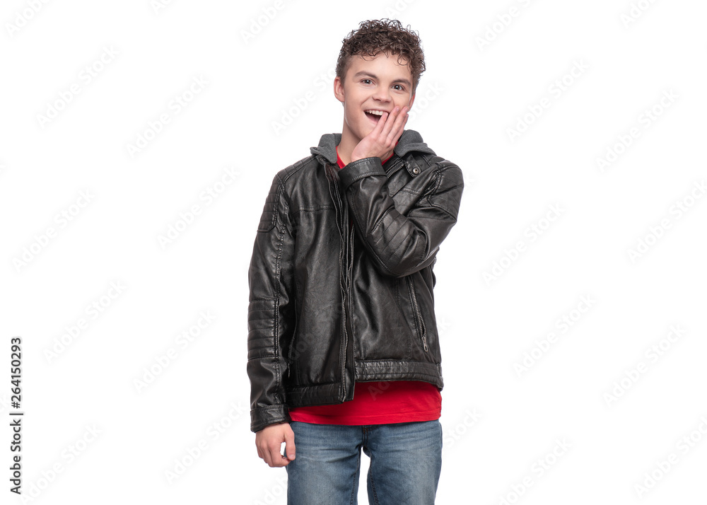 Portrait of a Handsome brutal Teen Boy in a black Leather Jacket. Surprised Smiling fashion Child Model isolated on white background. Funny Teenager touching his face. Portrait of a Handsome brutal Teen Boy in a black Leather Jacket. Surprised Smiling fashion Child Model isolated on white background. Funny Teenager touching his face.