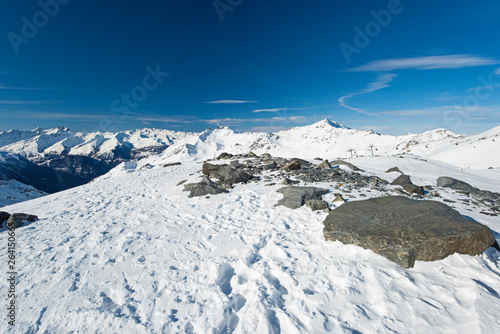Panoramic view down snow covered valley in alpine mountain range © Paul Vinten