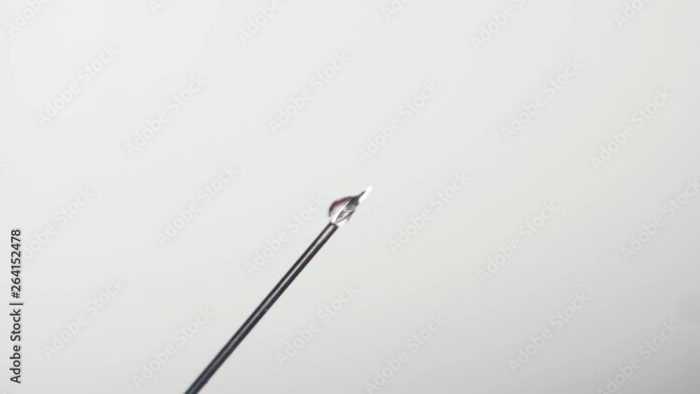 Close-up shot of a needle of syringe with medicine before injection Close-up shot of a needle of syringe with medicine before injection