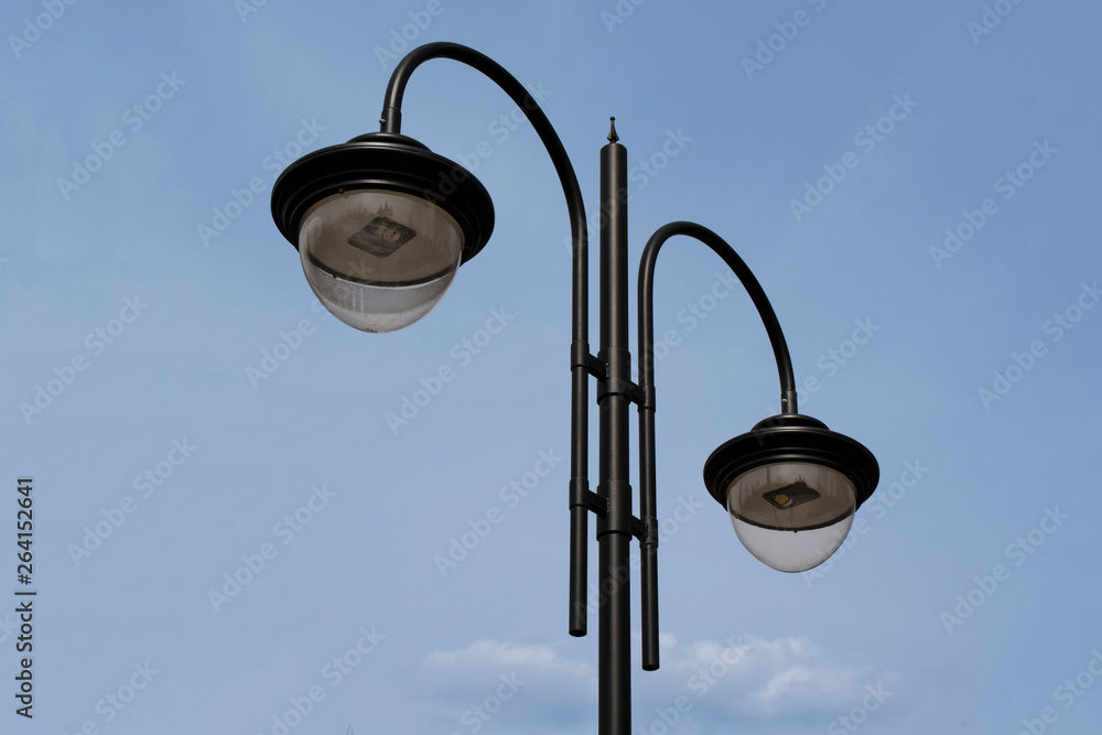 old street lamp on background of blue sky old street lamp on background of blue sky
